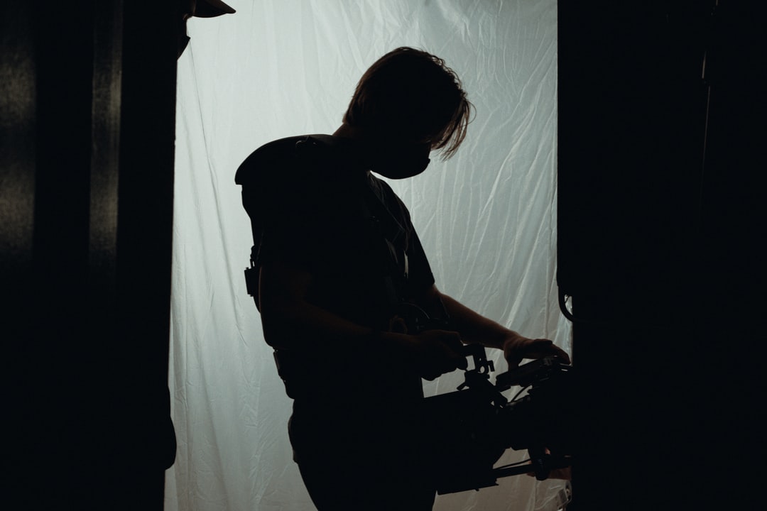 A man standing in a dark room